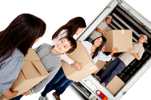 Professional packers organising boxes in a Streatham home