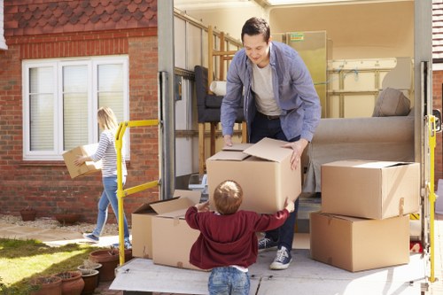 Removal van and moving boxes outside a Streatham home