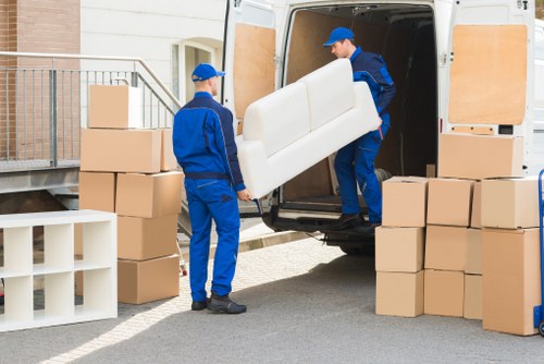 Moving boxes and furniture arranged for unloading at a Streatham property