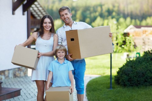 Professional movers carrying furniture during a Streatham house move