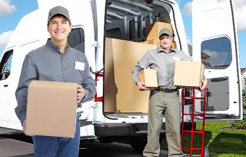 Professional movers loading household items for transport in Streatham