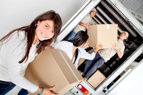 House movers handling furniture and boxes during a Streatham relocation